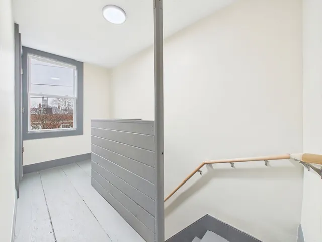 a view of a hallway with closet