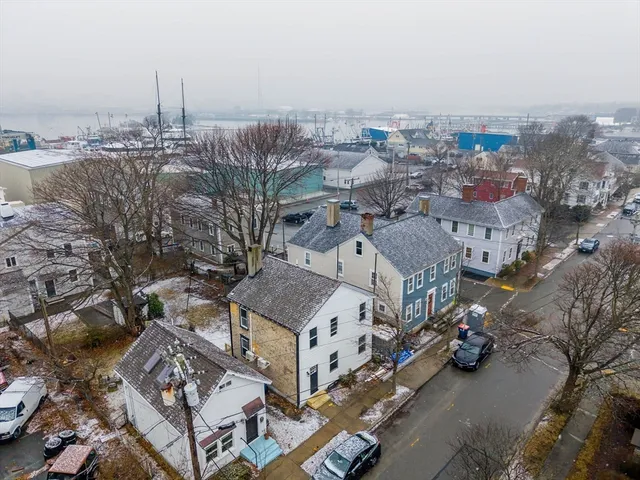 an aerial view of residential houses with outdoor space