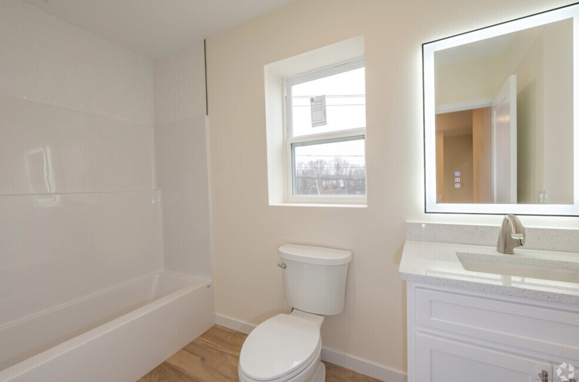 141 Bridge Street, Unit C Middletown, CT 06457 - Photo 4 of 12 a white toilet sitting next to a bath tub