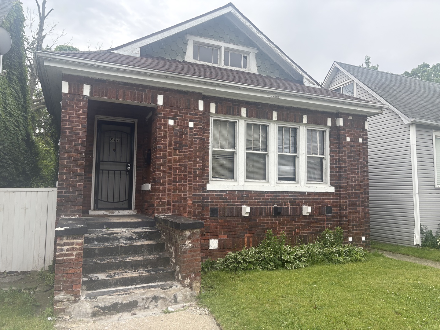511 West 104th Street Chicago, IL 60628 - Photo 1 of 10 a front view of a house