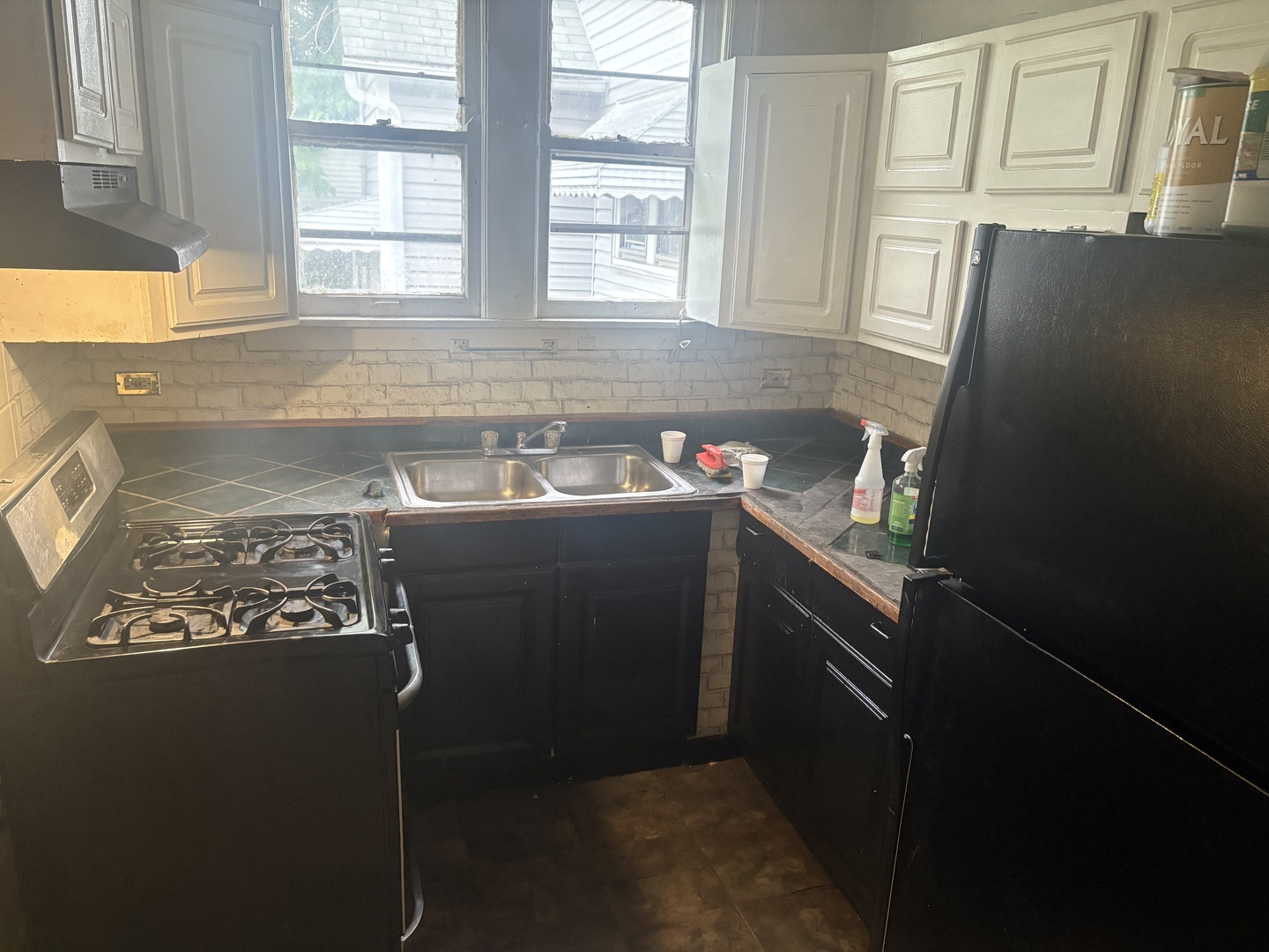 511 West 104th Street Chicago, IL 60628 - Photo 2 of 10 a bathroom with a sink a vanity and a window