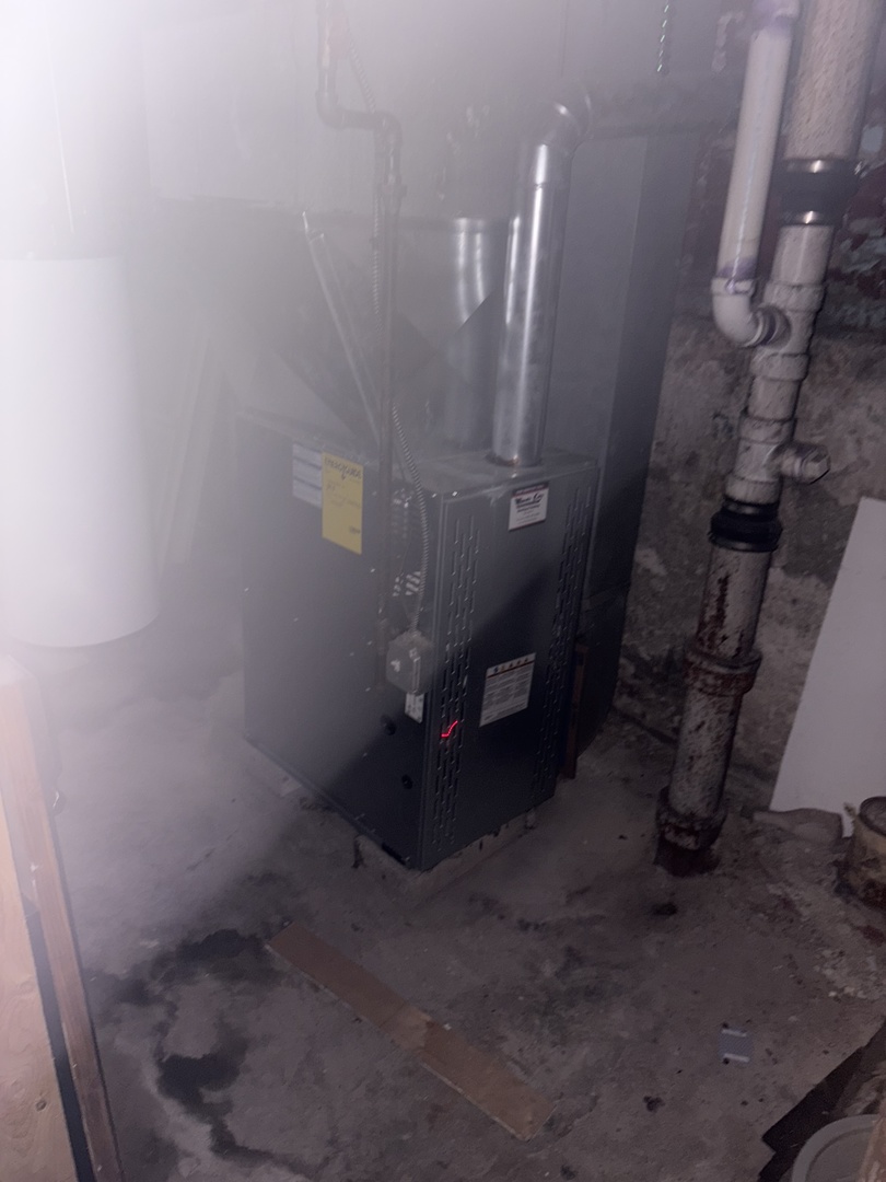 511 West 104th Street Chicago, IL 60628 - Photo 7 of 10 a view of a livingroom with water heater
