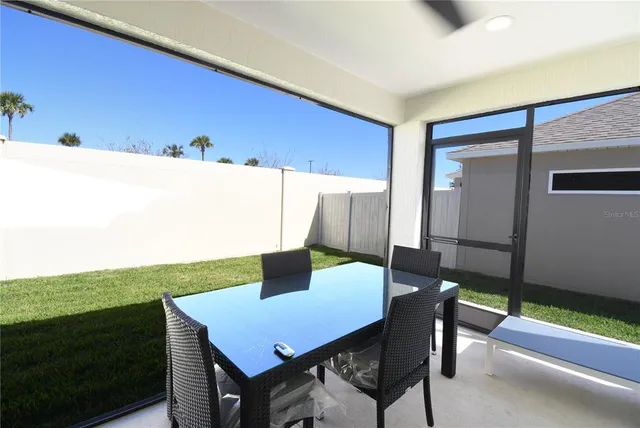 an aerial view of multiple houses with outdoor space
