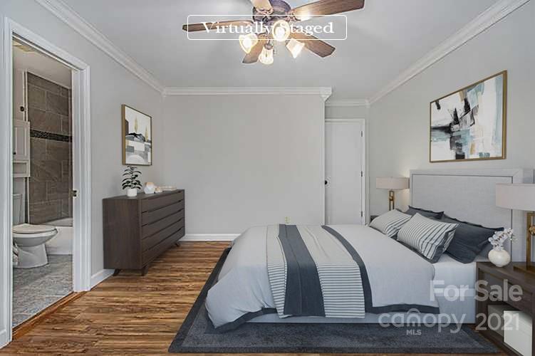 9618 Fairway Ridge Road Charlotte, NC 28277 - Photo 3 of 20 a bedroom with a bed and a chandelier
