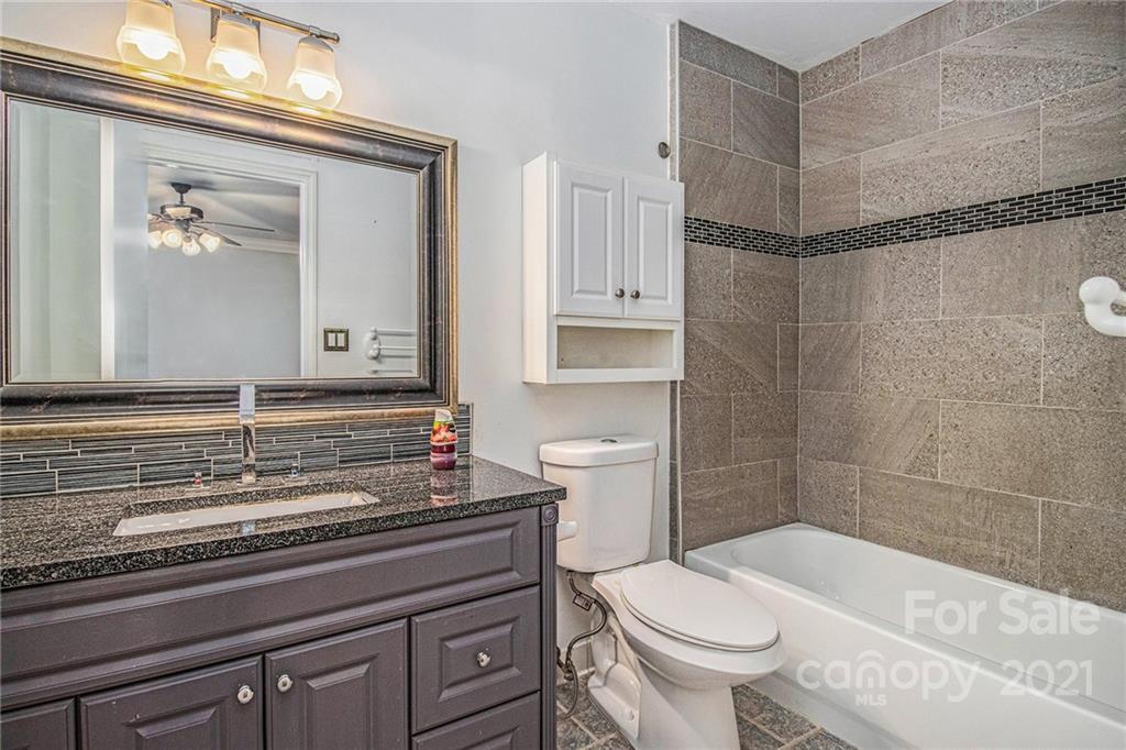 9618 Fairway Ridge Road Charlotte, NC 28277 - Photo 6 of 20 a bathroom with a sink a toilet and shower