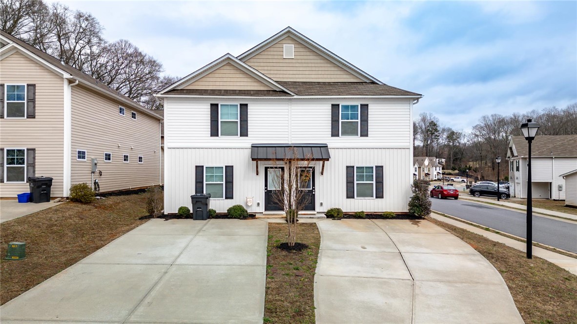 215 Royal Way Pendleton, SC 29670 - Photo 31 of 33 This charming duplex boasts a clean exterior, offering comfortable living with convenient driveway parking.