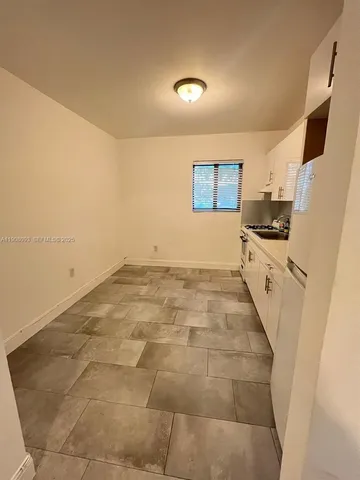 a view of a kitchen with a sink
