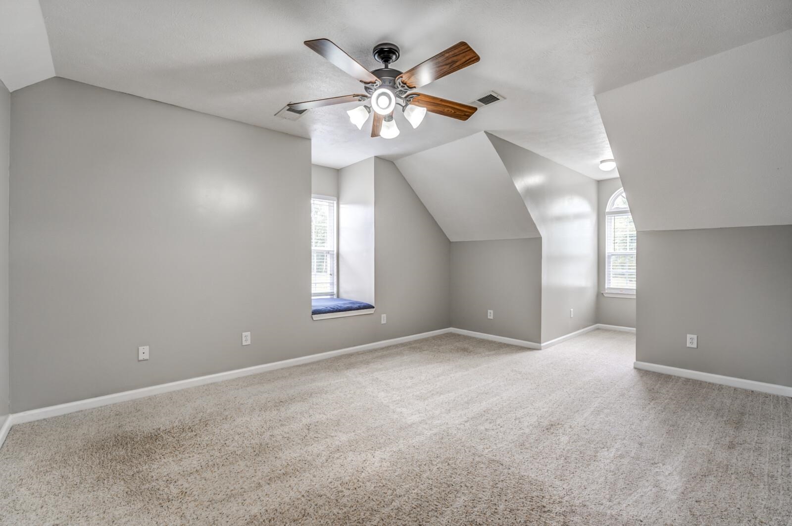 8649 Rankin Branch Road Millington, TN 38053 - Photo 17 of 34 Bonus room featuring light carpet, vaulted ceiling, and ceiling fan