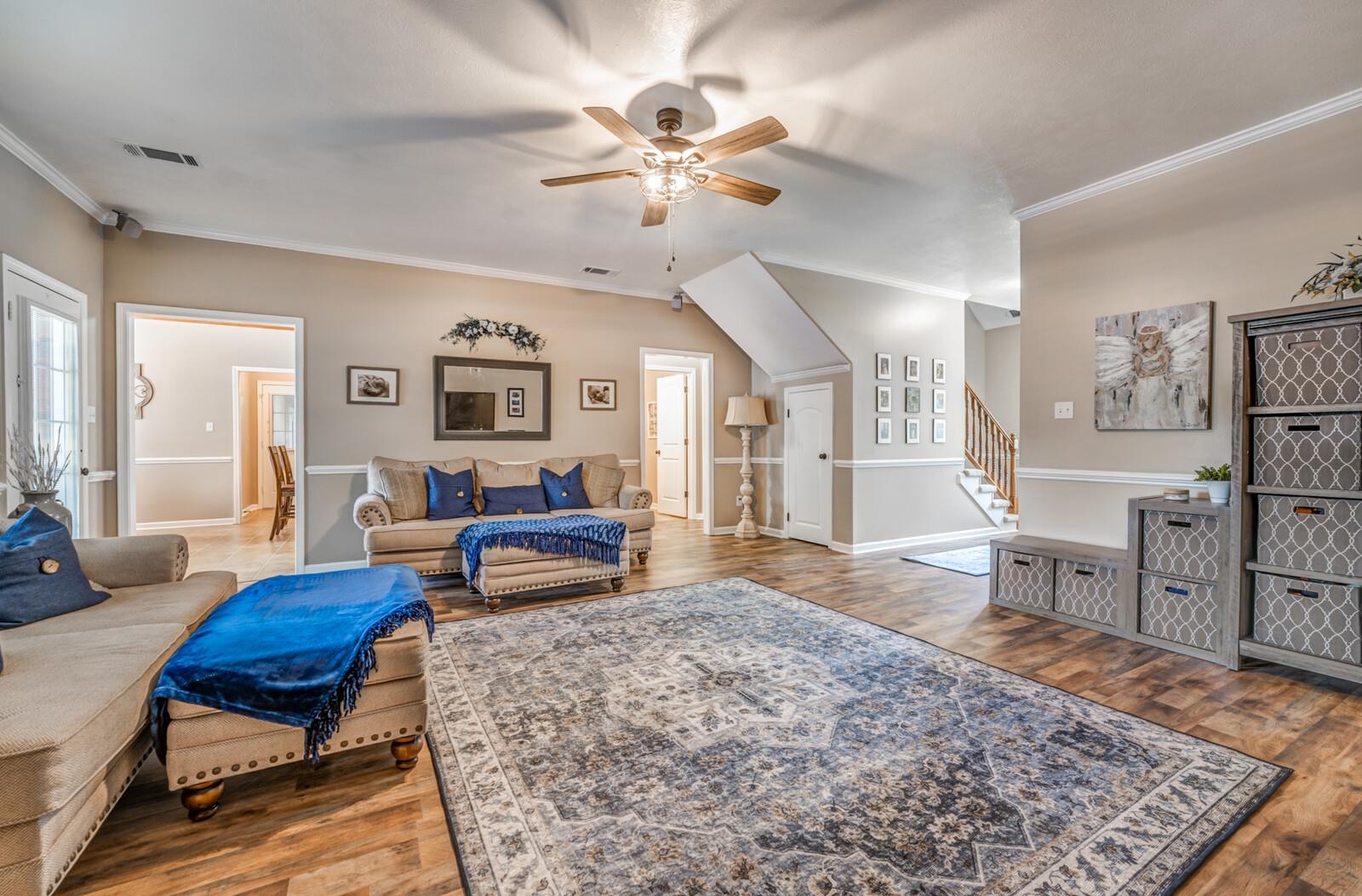 8649 Rankin Branch Road Millington, TN 38053 - Photo 6 of 34 Living room with hardwood / wood-style flooring, crown molding, and ceiling fan