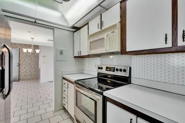 a kitchen with a stove and a microwave
