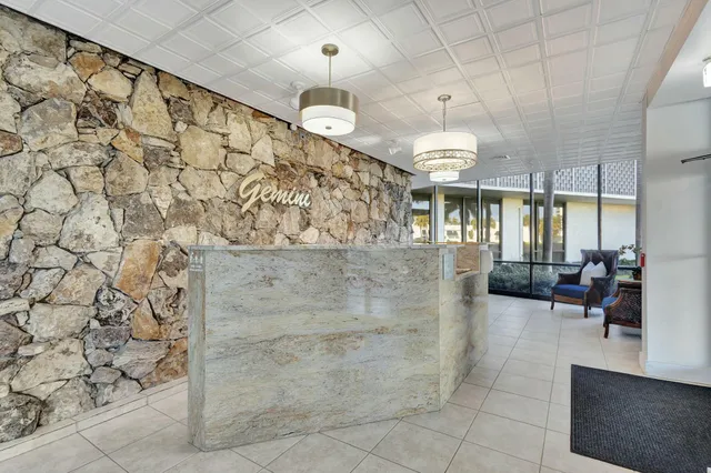a view of a swimming pool with chairs