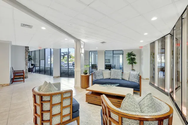 a living room with fireplace furniture and a wooden floor