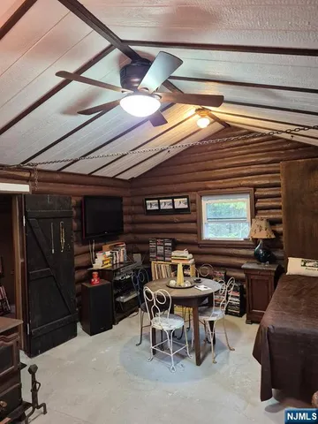 a dining space with furniture and a window