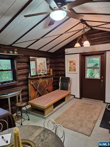 a bedroom with furniture and wooden floor