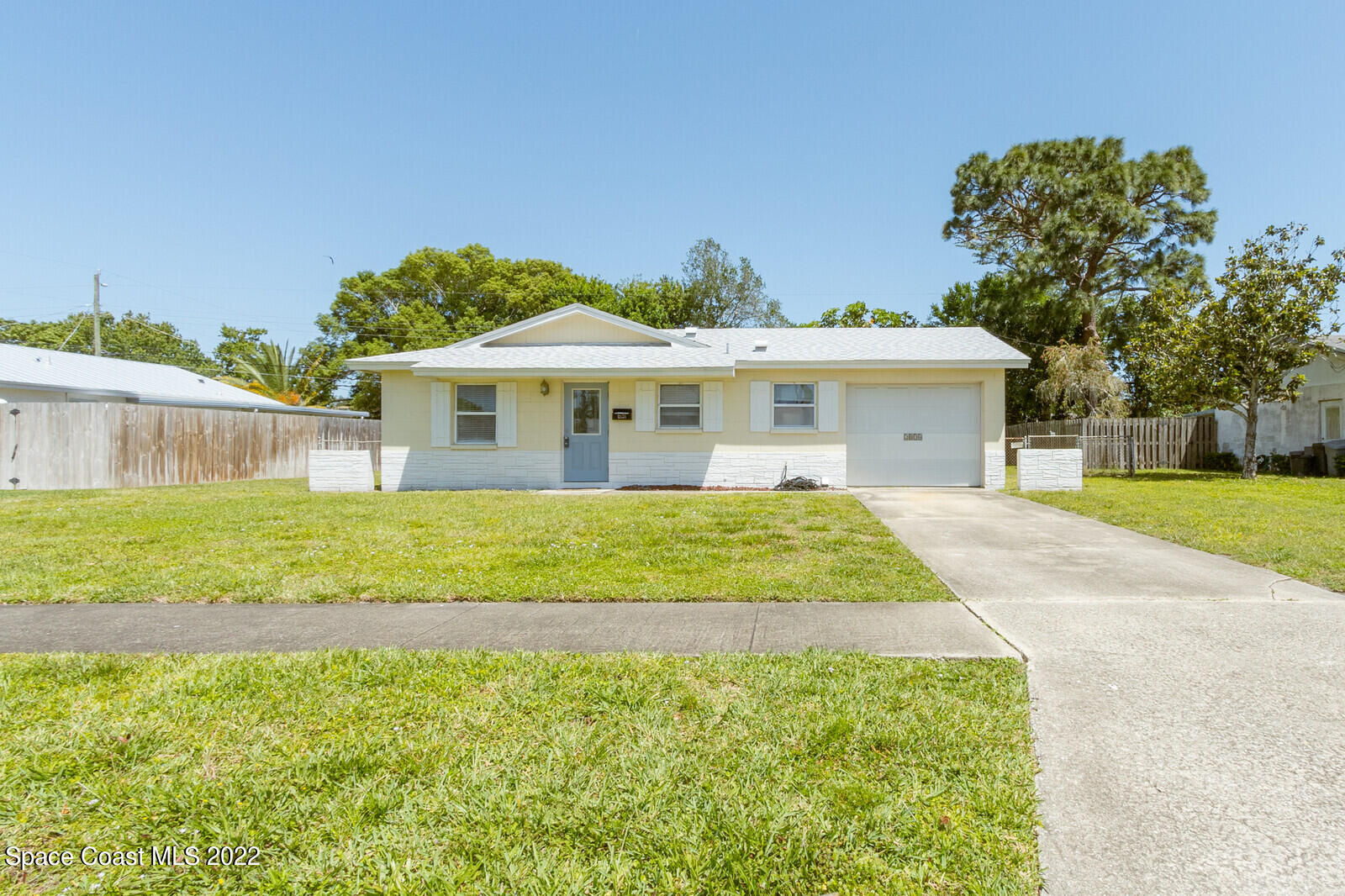 2834 Rheims Avenue Melbourne, FL 32935 - Photo 1 of 19 a house with garden in front of it