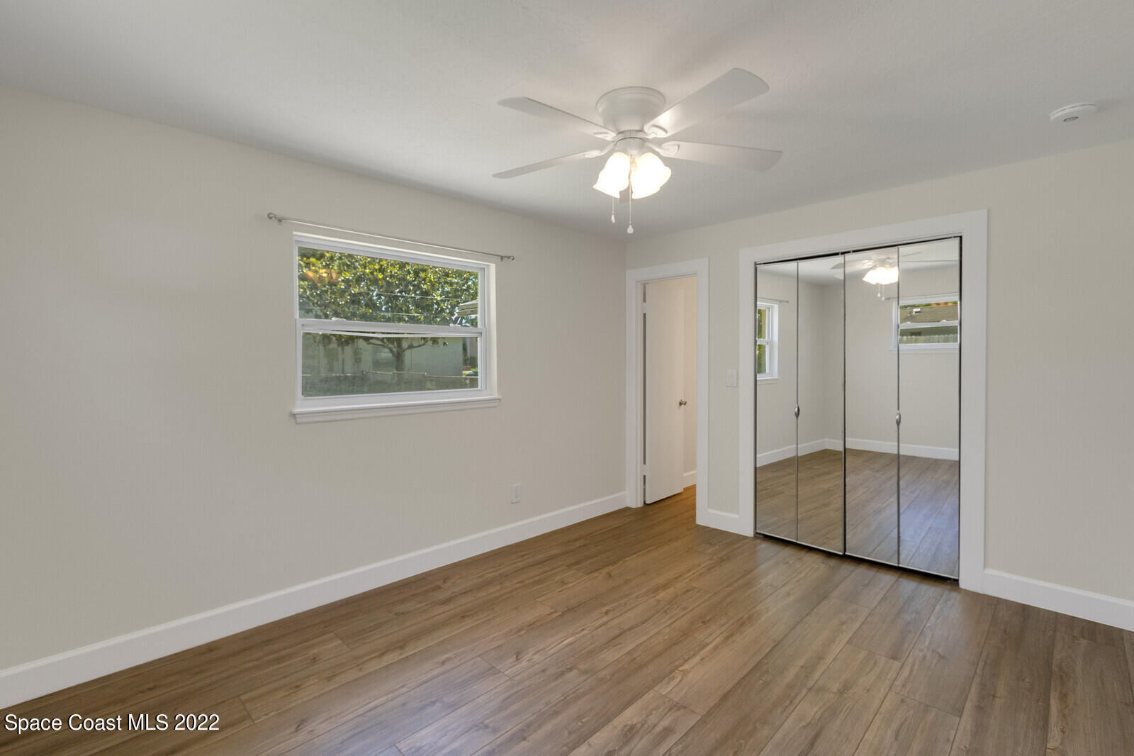 2834 Rheims Avenue Melbourne, FL 32935 - Photo 15 of 19 a view of an empty room with wooden floor