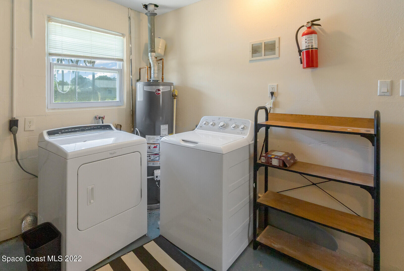 2834 Rheims Avenue Melbourne, FL 32935 - Photo 3 of 19 a utility room with dryer and washer