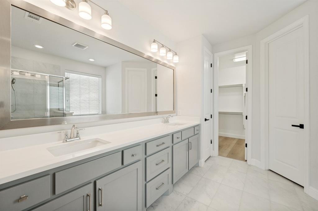 1000 Adair Road Prosper, TX 75078 - Photo 8 of 37 a spacious bathroom with a double vanity sink mirror and double