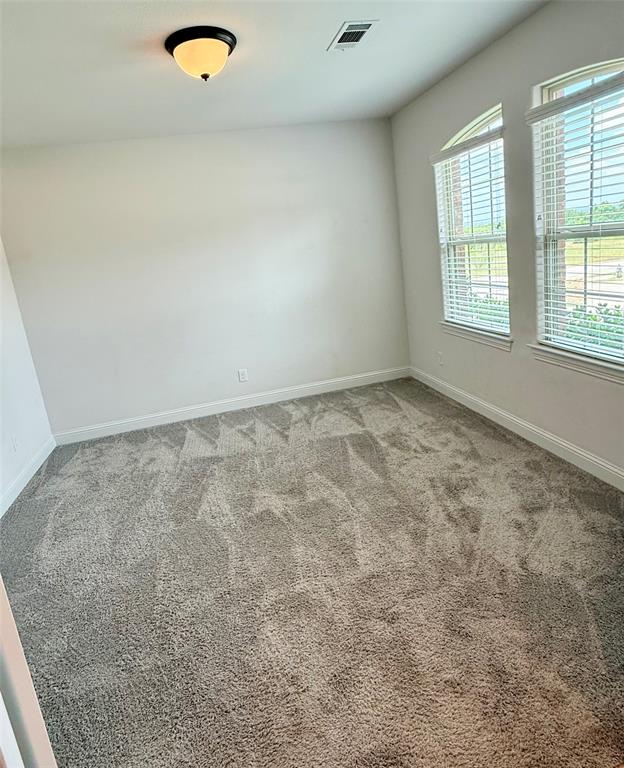 204 Flower Ridge Drive Fort Worth, TX 76108 - Photo 6 of 27 an empty room with windows