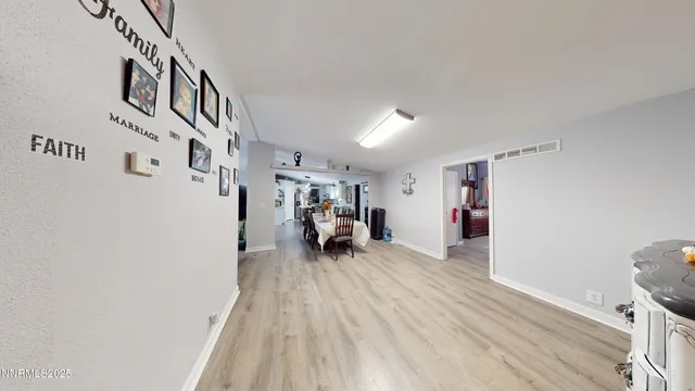 a view of a room with wooden floor and stairs