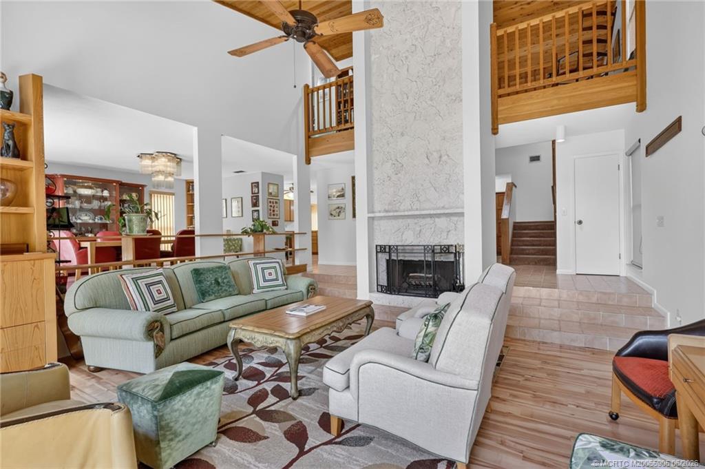 11145 Southwest Meadowlark Circle Stuart, FL 34997 - Photo 17 of 107 2 story wood working, keystone fireplace