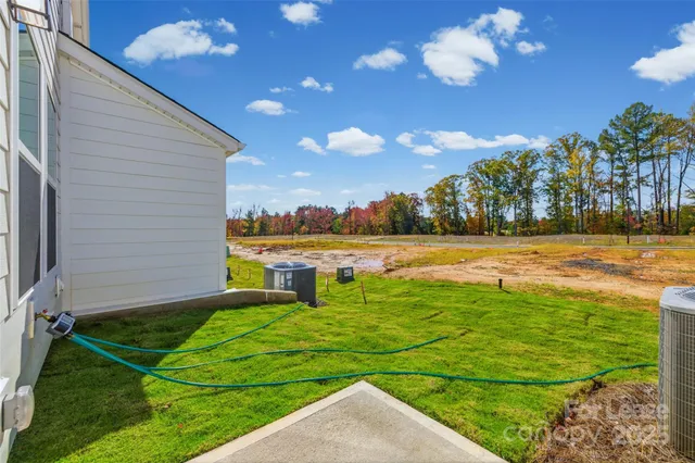 a view of a house with yard and front view of a house