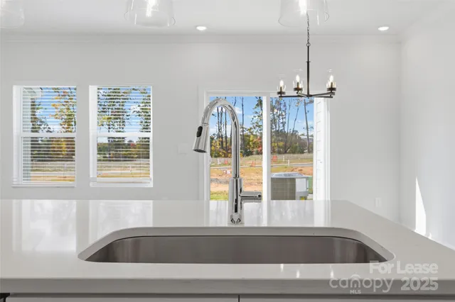 a view of a bathroom sink and a window