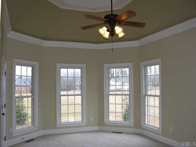 3313 Cotton Road Raleigh, NC 27601 - Photo 3 of 10 1st floor master has raised trey ceiling, fan, bay wall with 4 windows, walk-in closet and private entrance to screened porch. Other