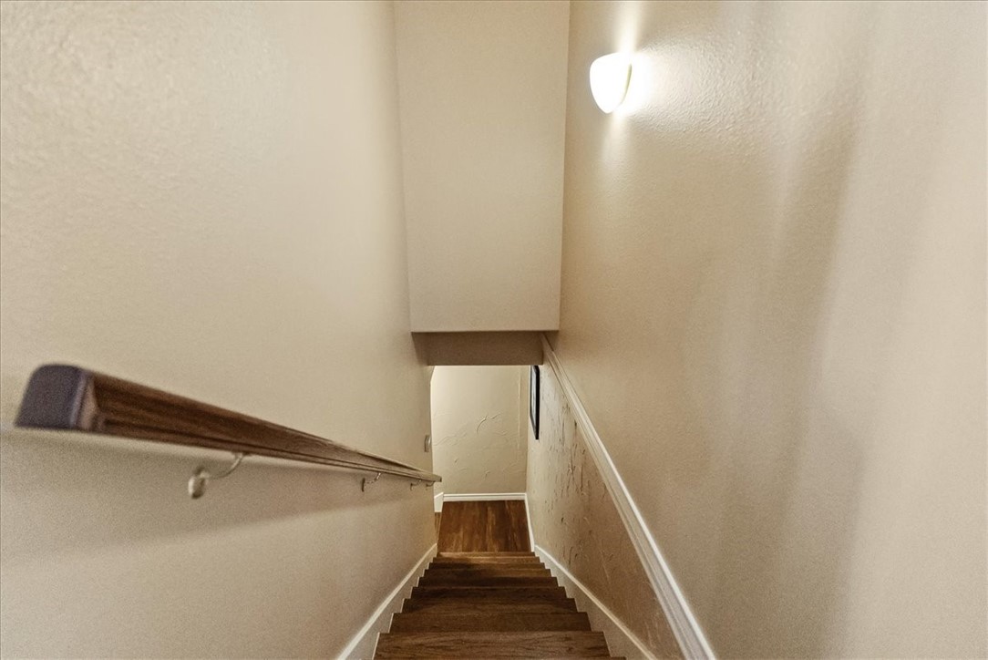 9129 County Road 2226 Taft, TX 78390 - Photo 16 of 40 Staircase to garage, pool, and lower level