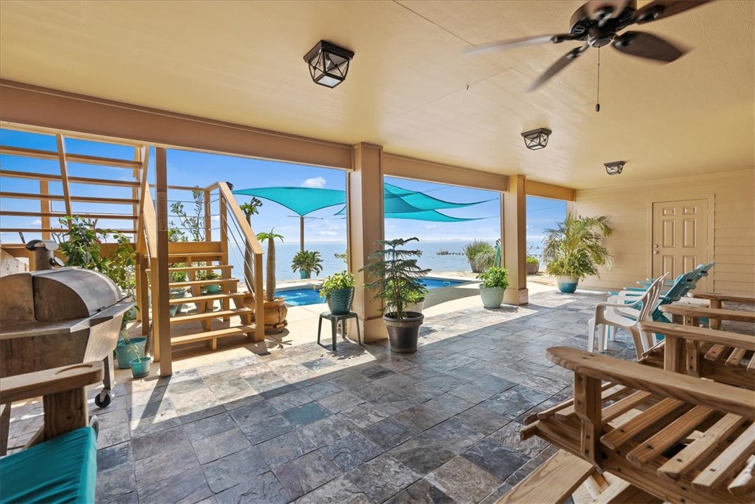 9129 County Road 2226 Taft, TX 78390 - Photo 22 of 40 Lower covered patio with pool and water view