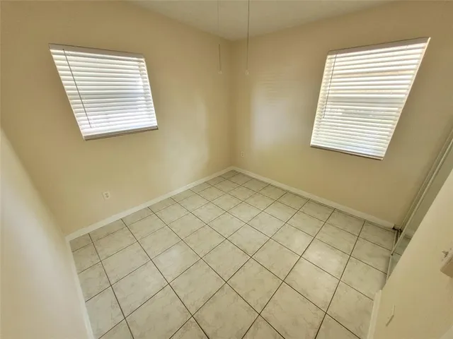 a view of an empty room and a window