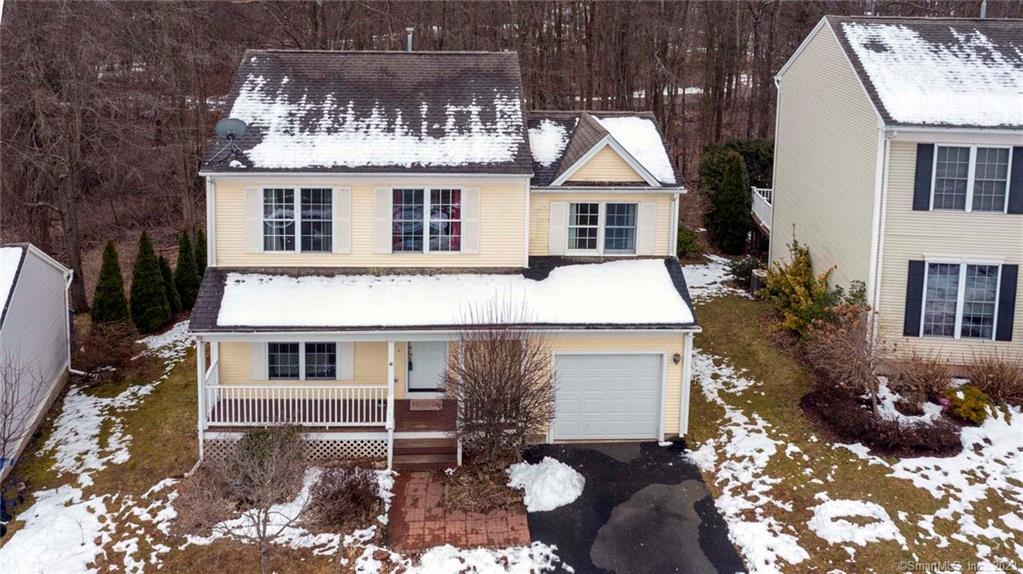85 Mountain Laurel Way, Unit 85 Suffield, CT 06078 - Photo 1 of 1 a front view of a house with a yard
