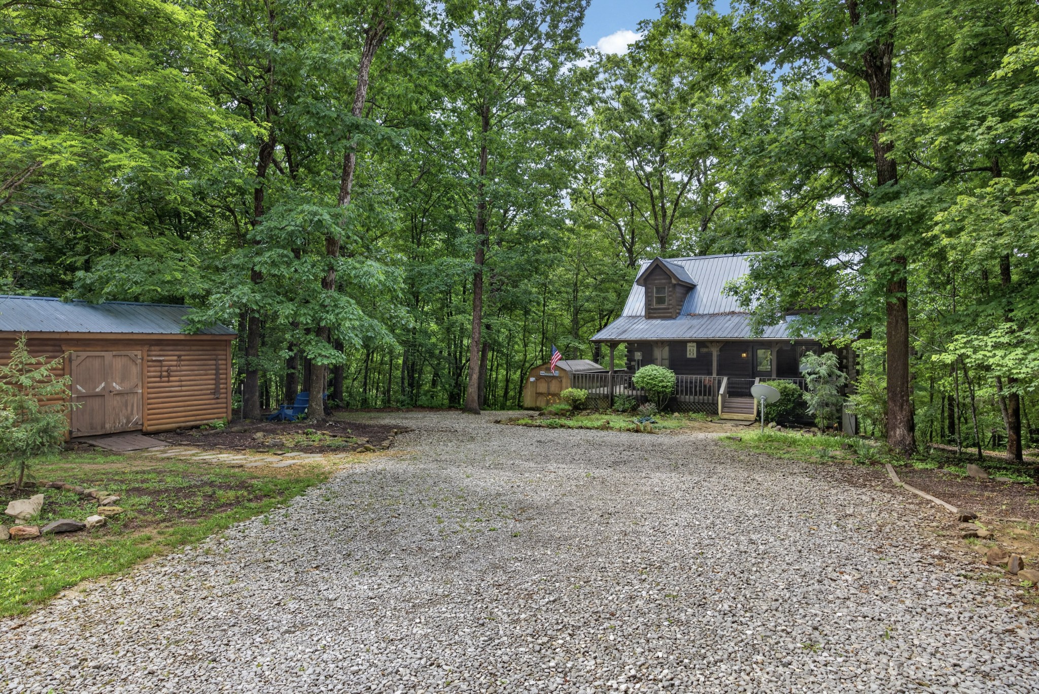 55214 Maynard Ridge Lane Crawford, TN 38554 - Photo 1 of 32 a house with a tree in front of it