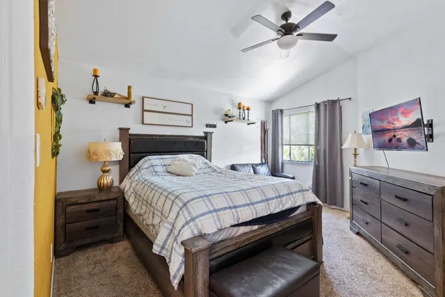 a bedroom with a bed and a dresser