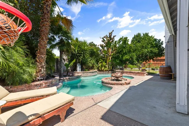 a view of a patio with swimming pool