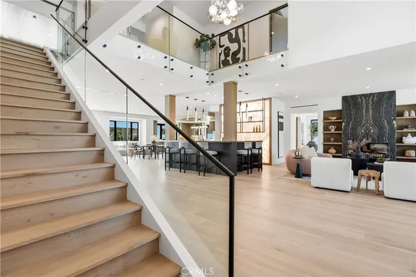 a view of entryway and hall with wooden floor