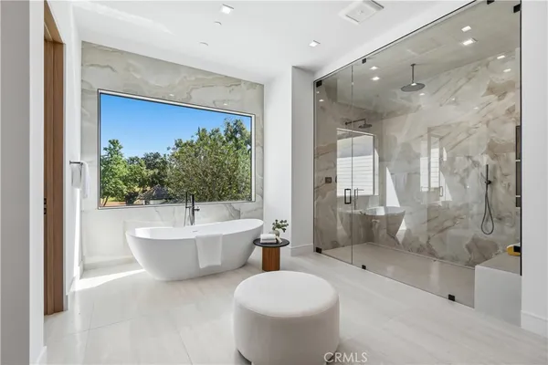 a bathroom with a tub toilet and sink