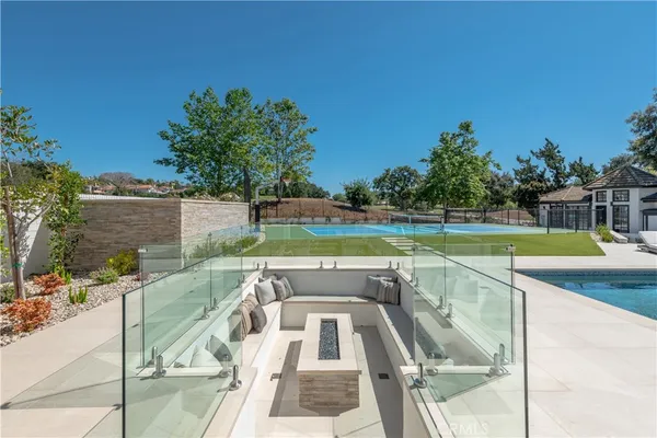a view of swimming pool with seating area
