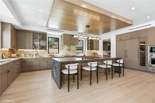 a kitchen with lots of counter top space and breakfast area