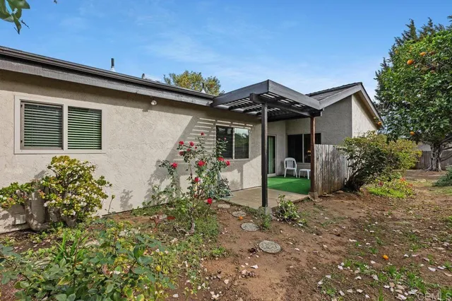 a bedroom with a bed chair and a window