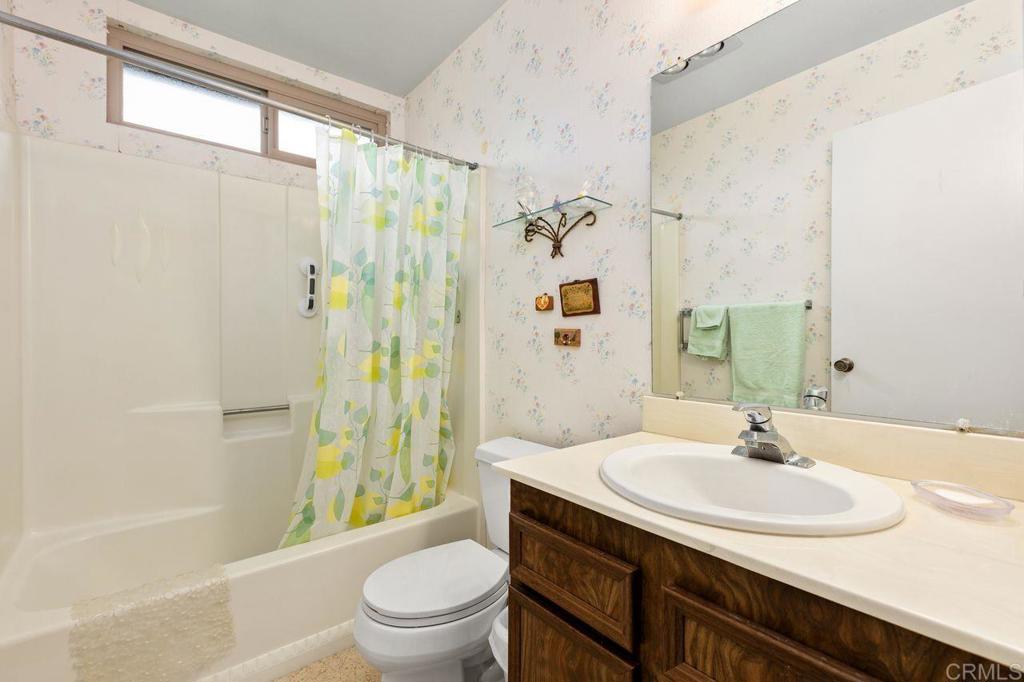 727 Nob Circle Vista, CA 92084 - Photo 22 of 39 a bathroom with a sink toilet and shower
