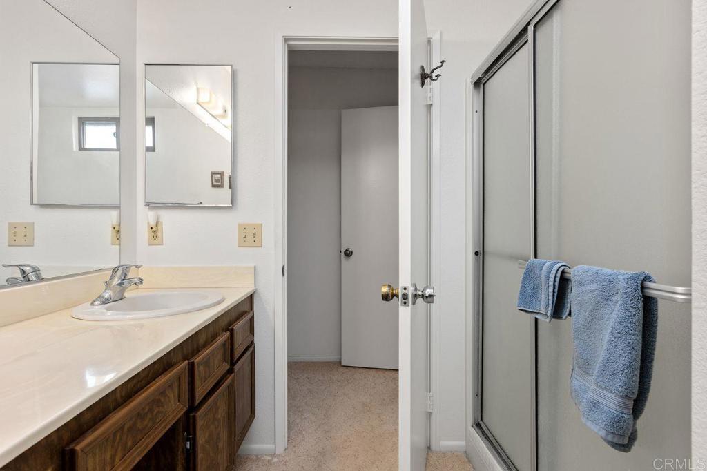 727 Nob Circle Vista, CA 92084 - Photo 25 of 39 a bathroom with a sink and mirror