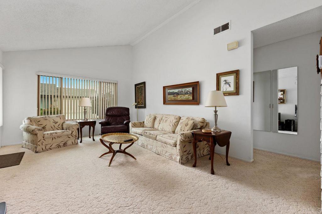 727 Nob Circle Vista, CA 92084 - Photo 4 of 39 a living room with furniture and a window