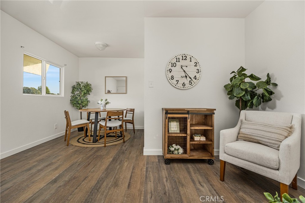 6725 Perry Road Bell Gardens, CA 90201 - Photo 18 of 40 a living room with furniture and wooden floor