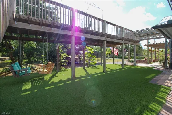 a view of a backyard with plants and a patio