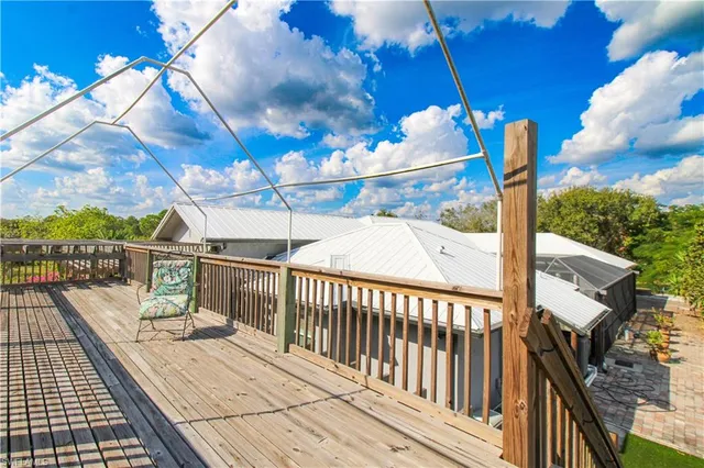 a view of a patio with table and chairs and potted plants