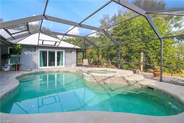 a view of yard with swimming pool outdoor seating and yard