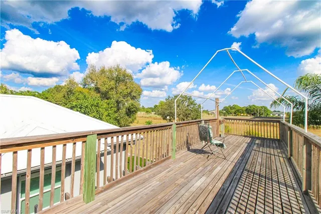 a view of a balcony with wooden floor