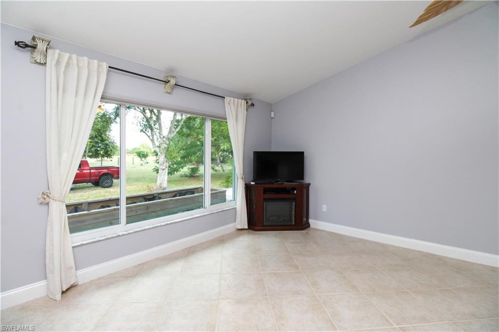 3935 70th Avenue Northeast Naples, FL 34120 - Photo 32 of 50 a view of room with furniture and a flat screen tv