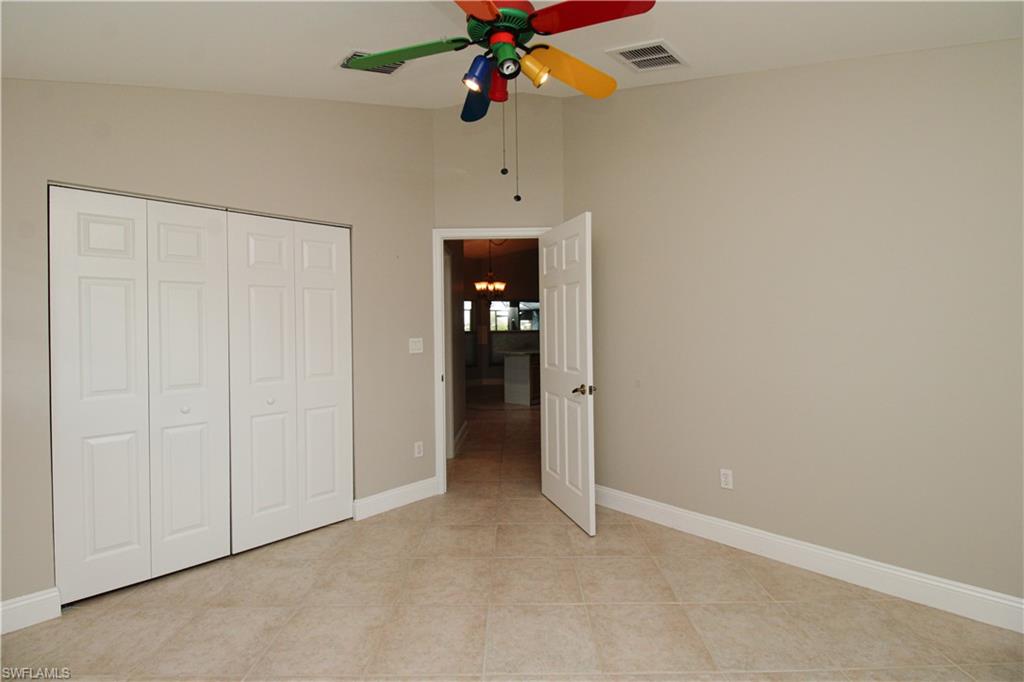 3935 70th Avenue Northeast Naples, FL 34120 - Photo 44 of 50 an empty room with closet and a ceiling fan